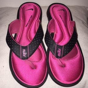 Pink and black nike sandals